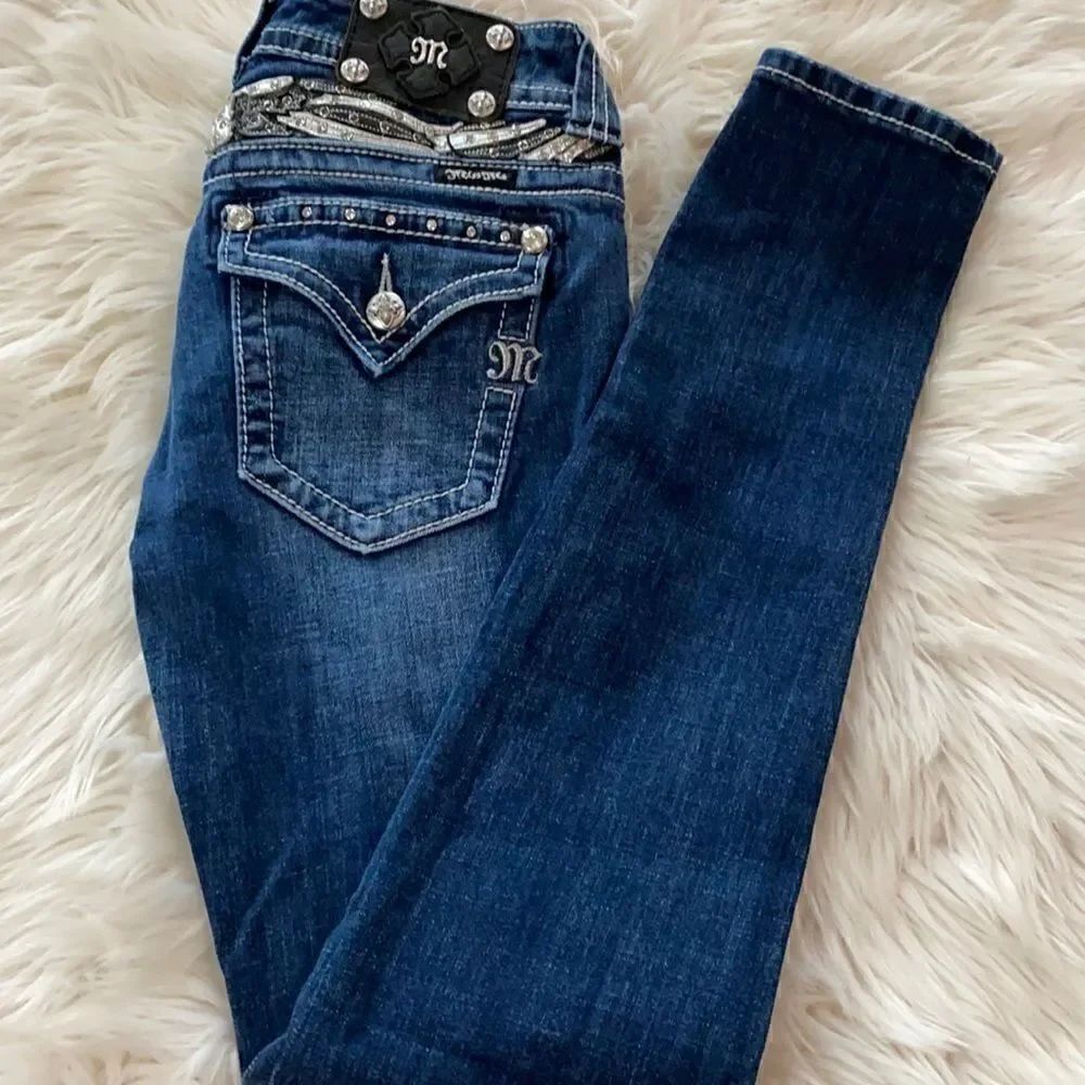Miss Me | Mid Rise Stretchy Back Flap Pocket Skinny Jeans | 27
